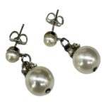 Pierced faux pearl dangle earrings.