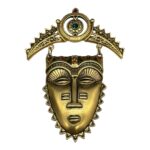 Avon tribal mask brooch.