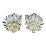 Trifari faux pearl and rhinestone clip earrings.