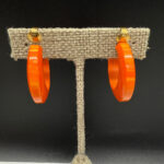 Vintage Orange Bakelite hoops.