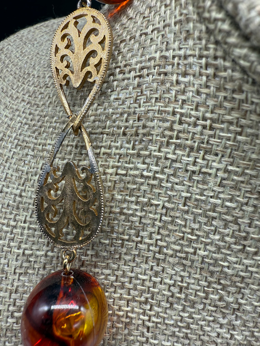 Amber-colored Lucite station necklace metal wear.