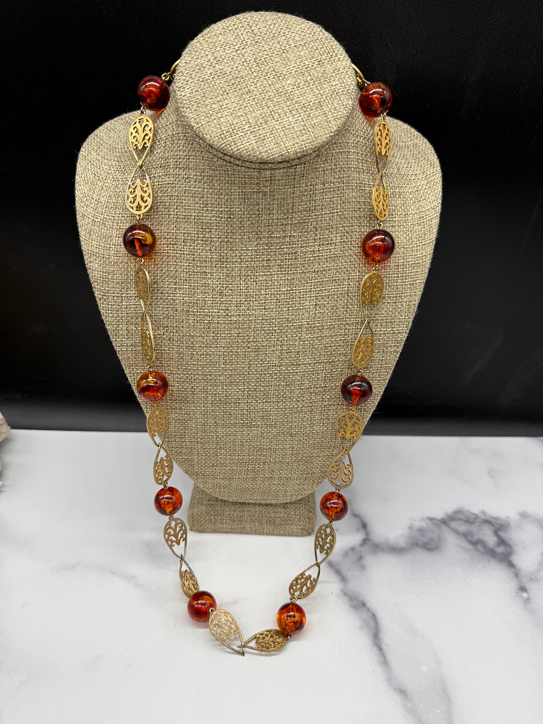 Amber-colored Lucite station necklace.