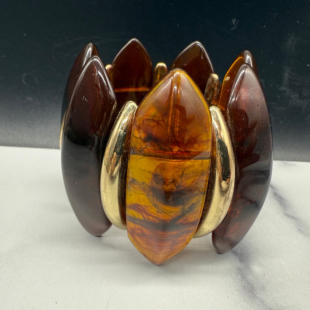 Amber-colored Lucite stretch bracelet.