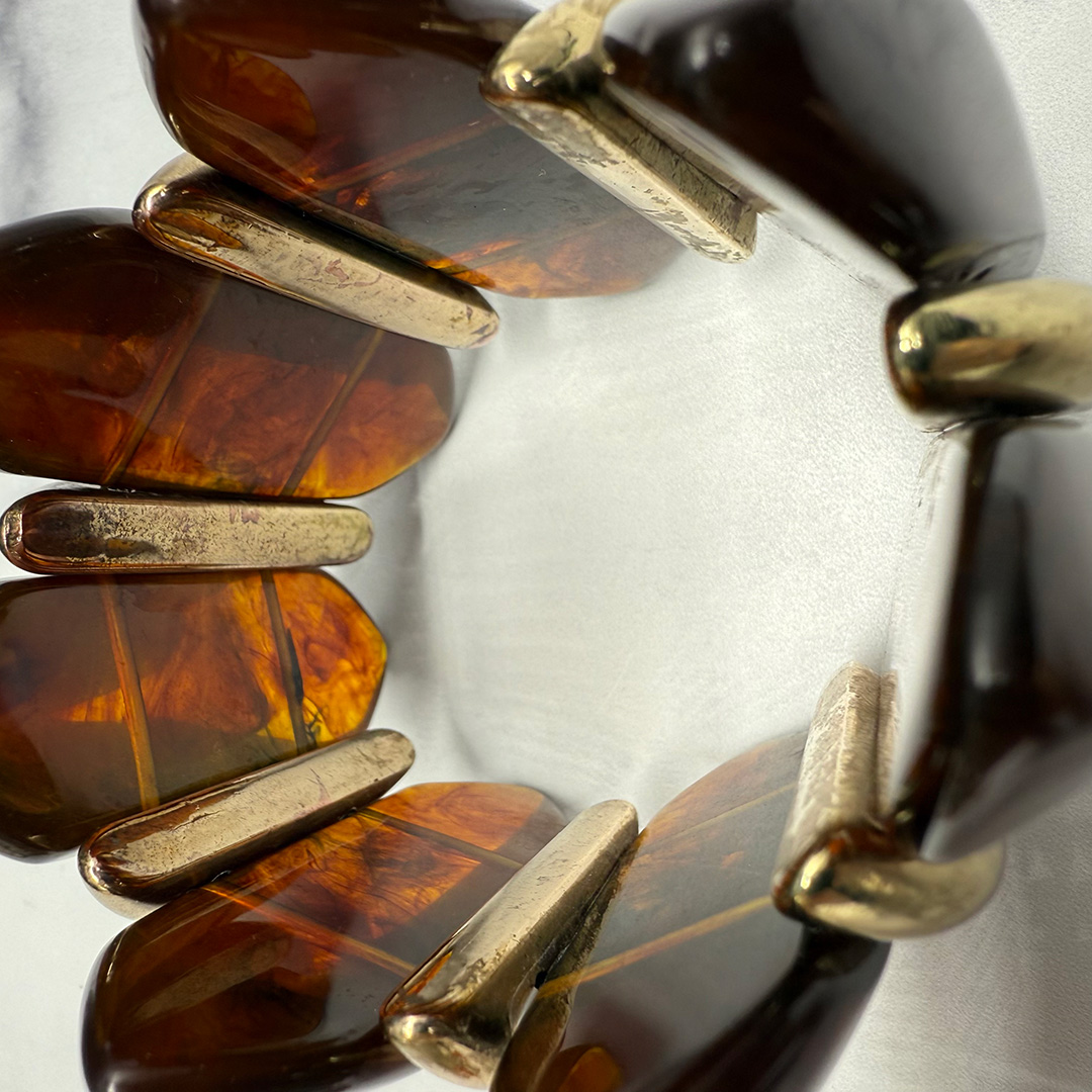 Amber-colored Lucite stretch bracelet.