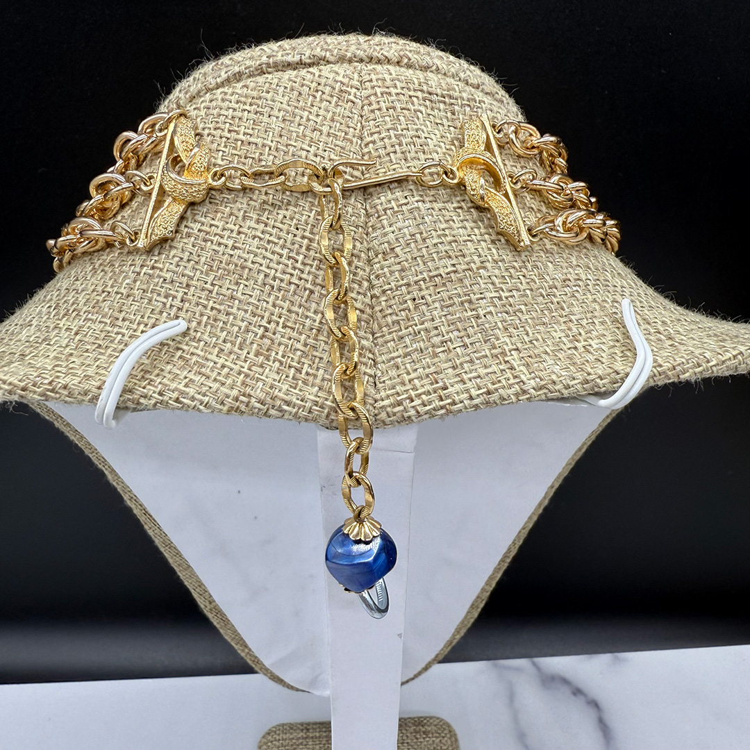 Coro triple-strand bead bib necklace.