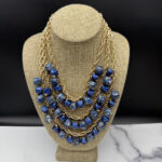 Coro triple-strand bead bib necklace.