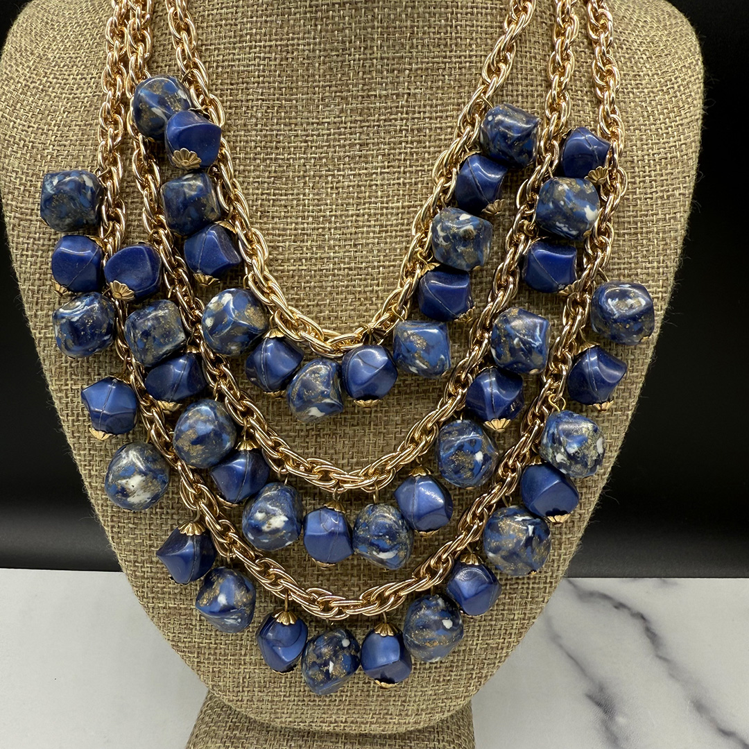 Coro triple-strand bead bib necklace.