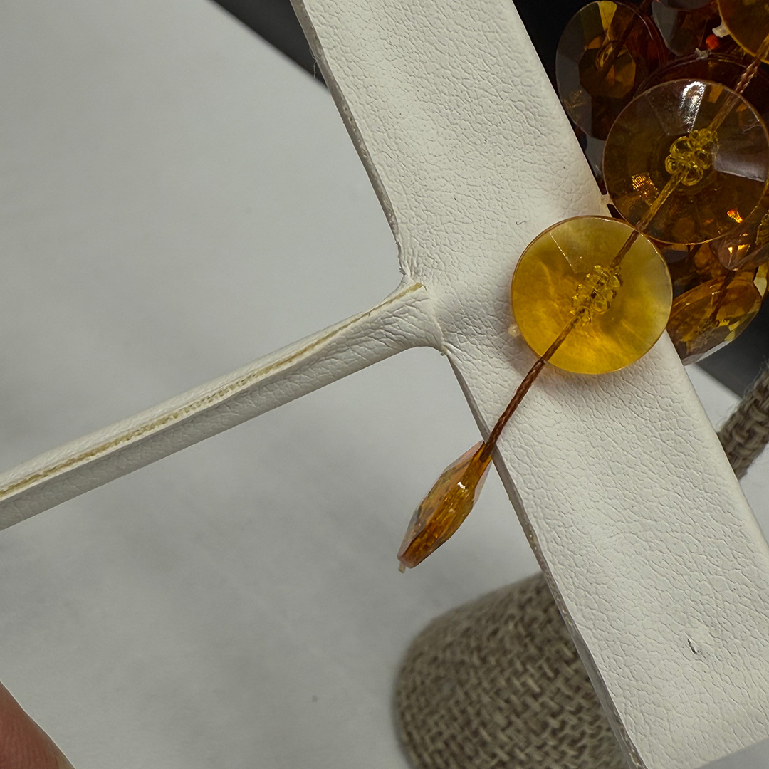 Topaz-colored pom pom earrings.