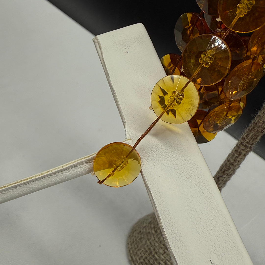 Topaz-colored pom pom earrings.