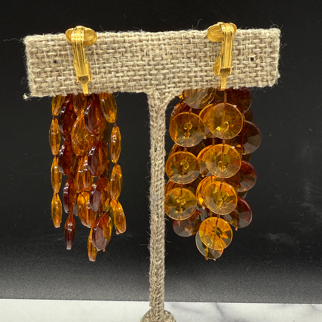 Topaz-colored pom pom earrings.