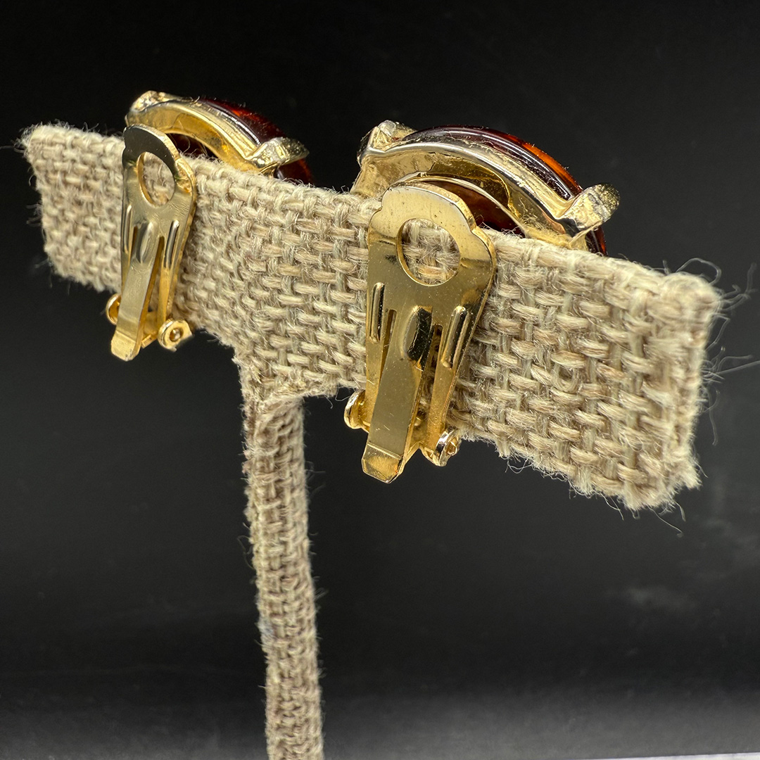 Vintage amber-colored resin button earrings.