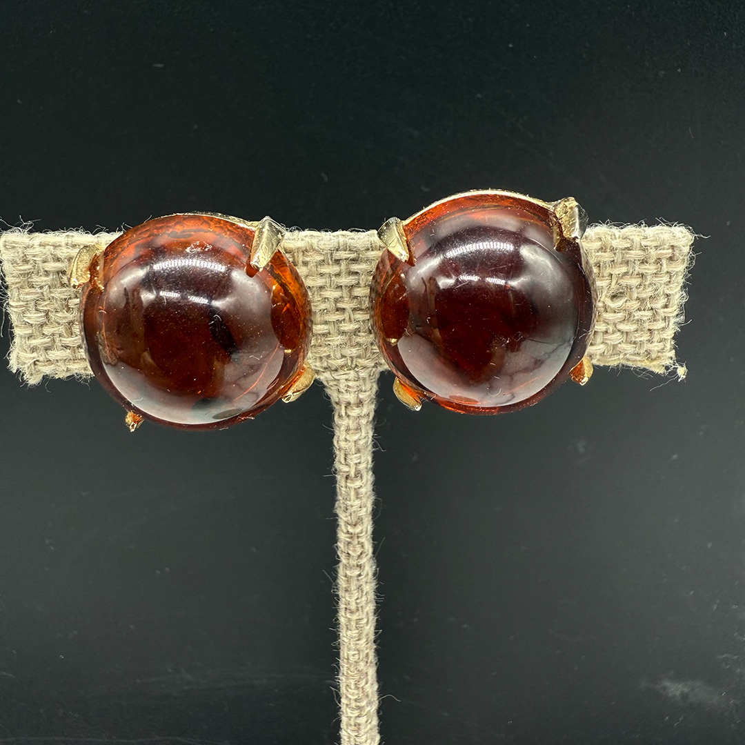 Vintage amber-colored resin button earrings.
