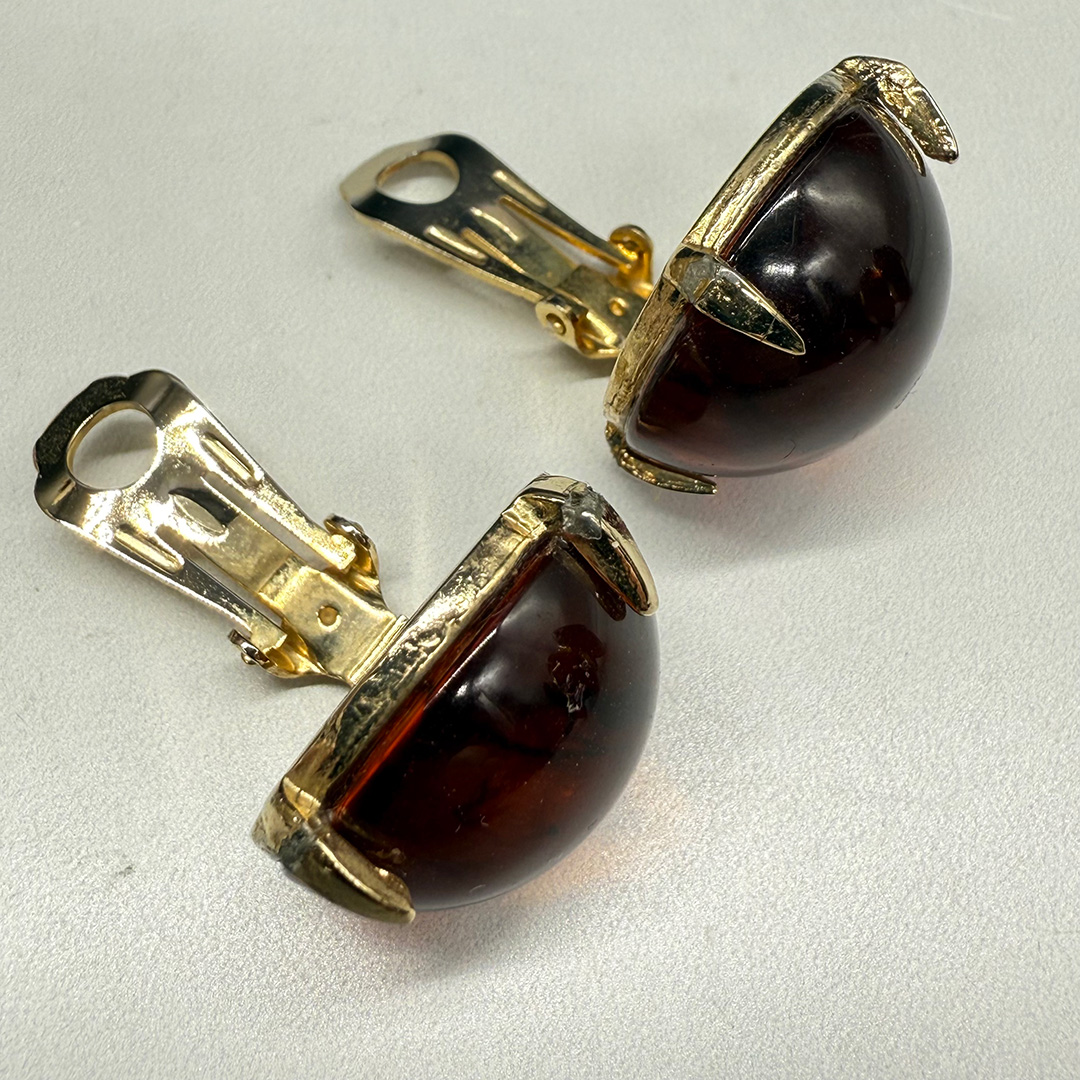 Vintage amber-colored resin button earrings.