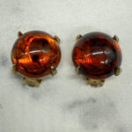 Vintage amber-colored resin button earrings.