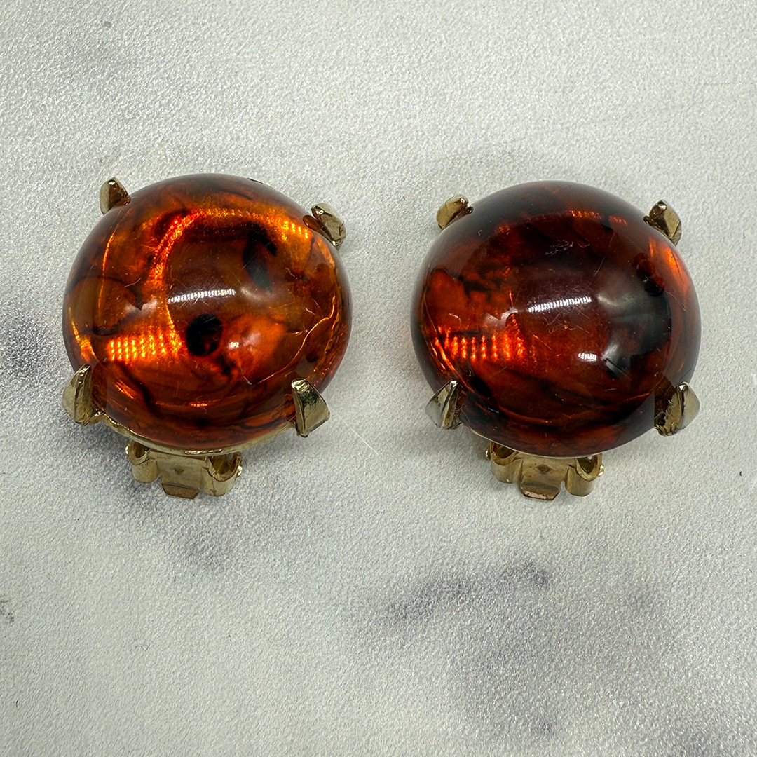 Vintage amber-colored resin button earrings.