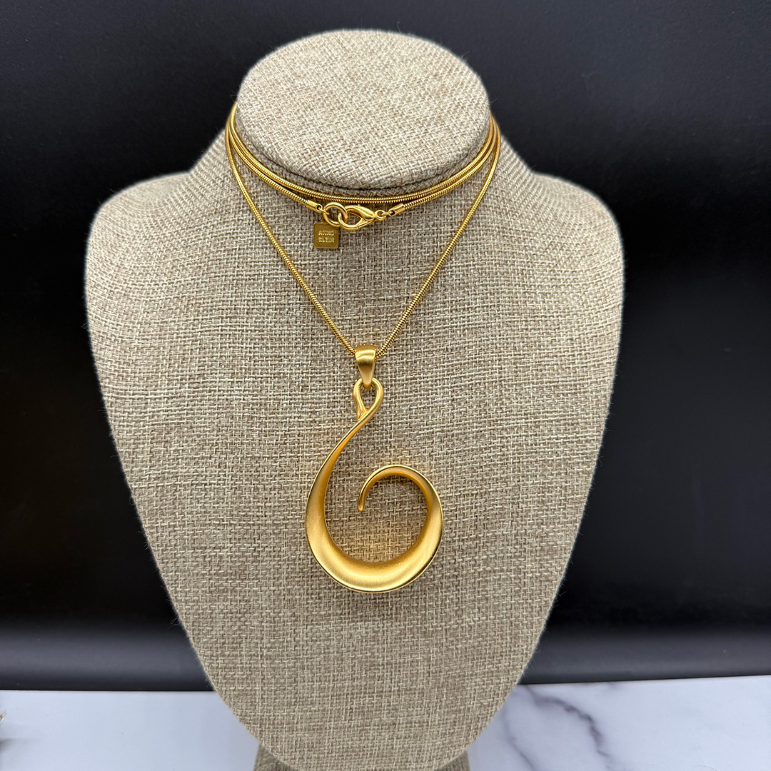 Vintage Anne Klein curlicue pendant necklace.
