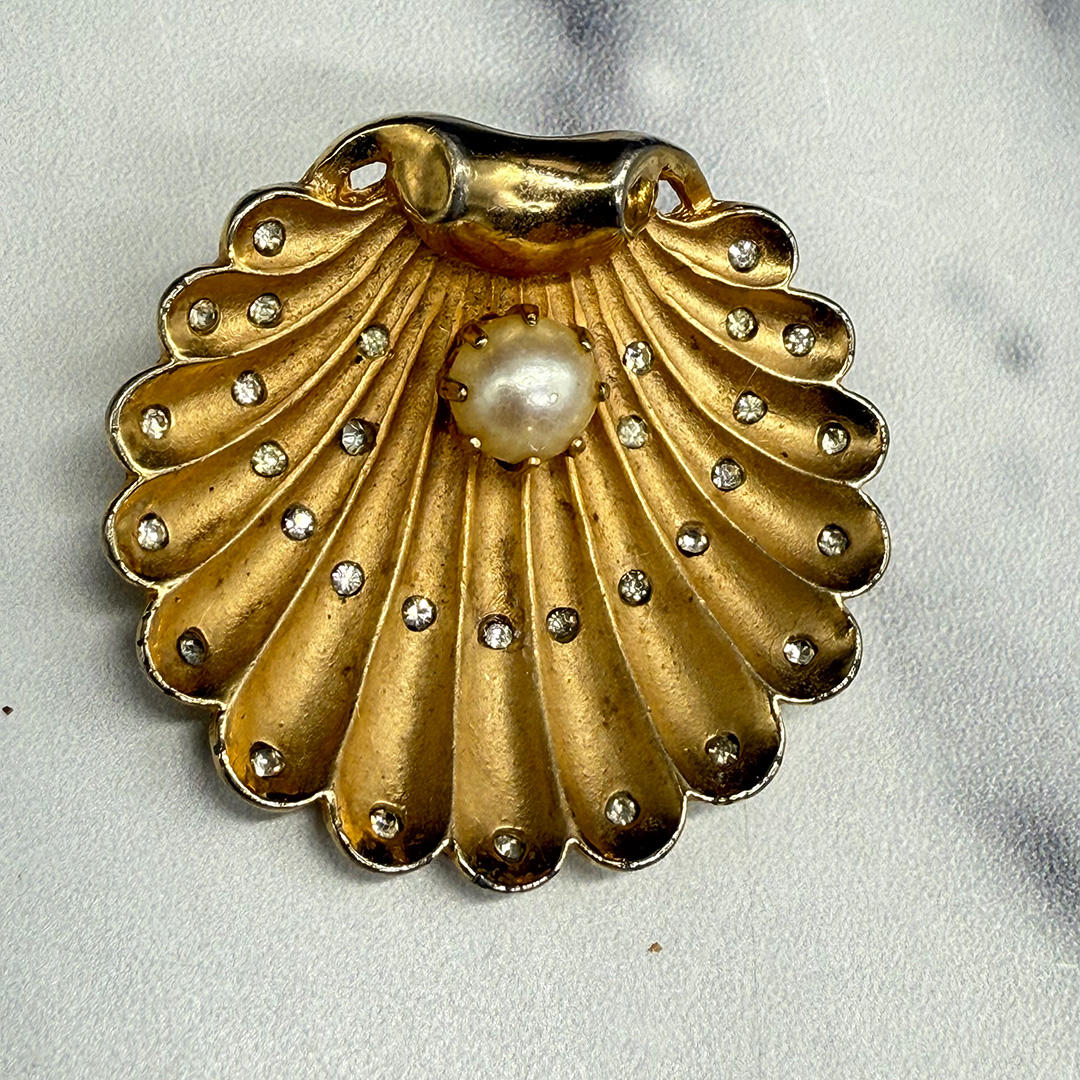 1940 figural shell brooch with pearl.
