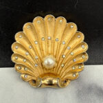 1940 figural shell brooch with pearl.