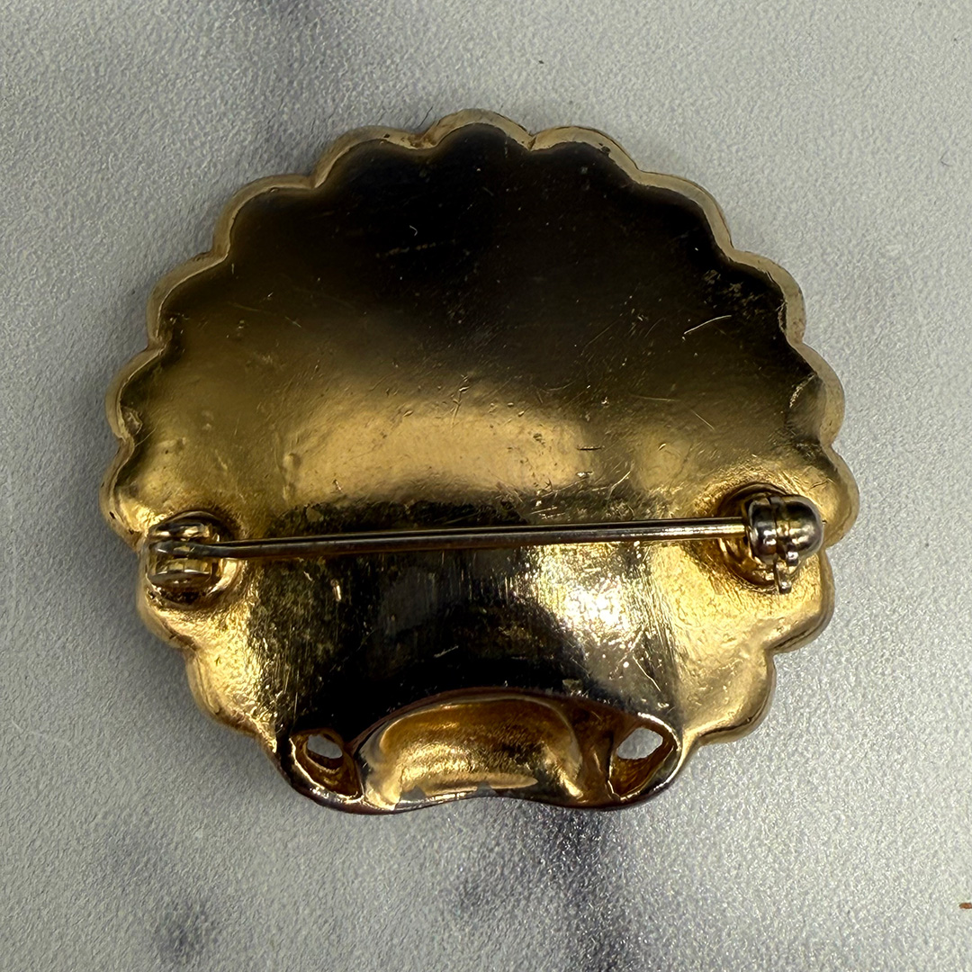 1940 figural shell brooch with pearl.