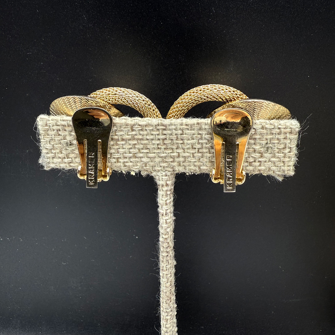 Kramer gold tone clip back earrings.