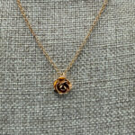 Rose pendant necklace.