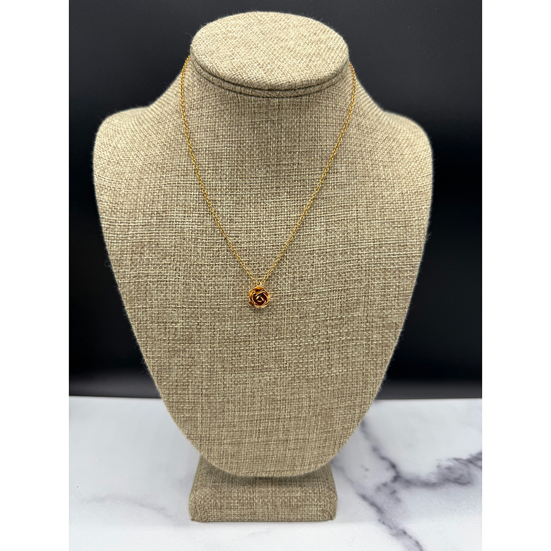 Rose pendant necklace.