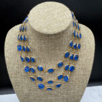 Triple-layer Coro-style bezel-set necklace.
