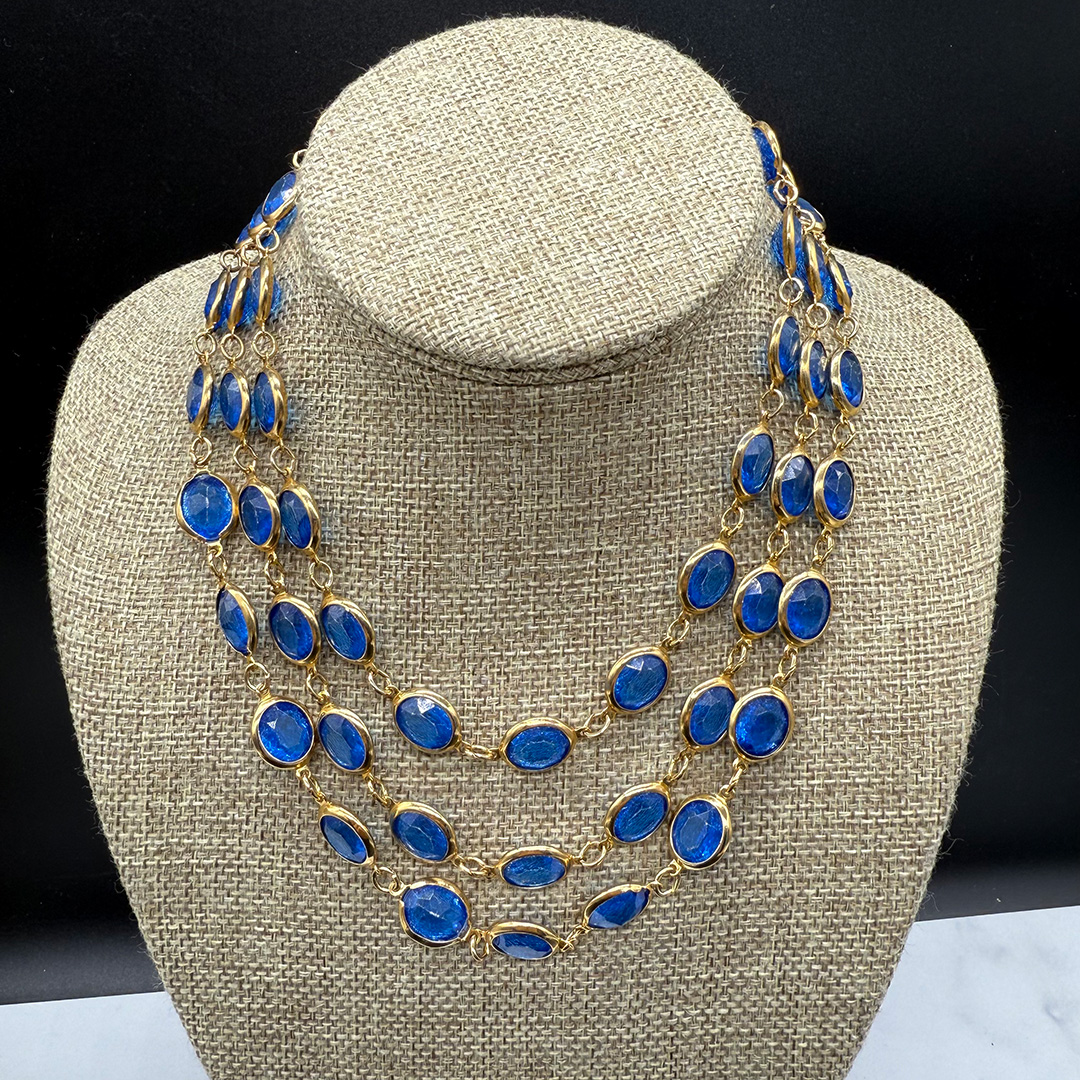 Triple-layer Coro-style bezel-set necklace.