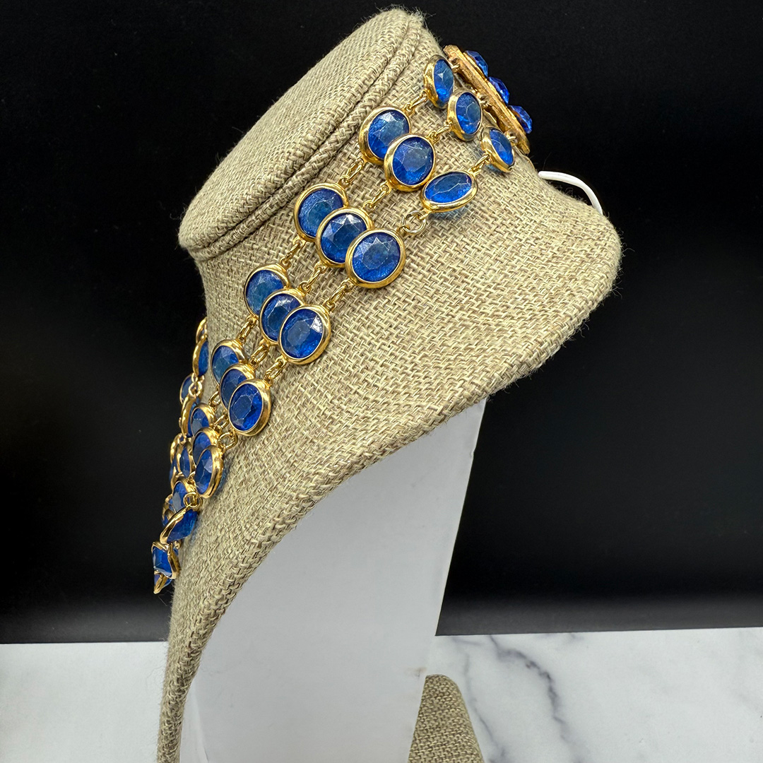 Triple-layer Coro-style bezel-set necklace.