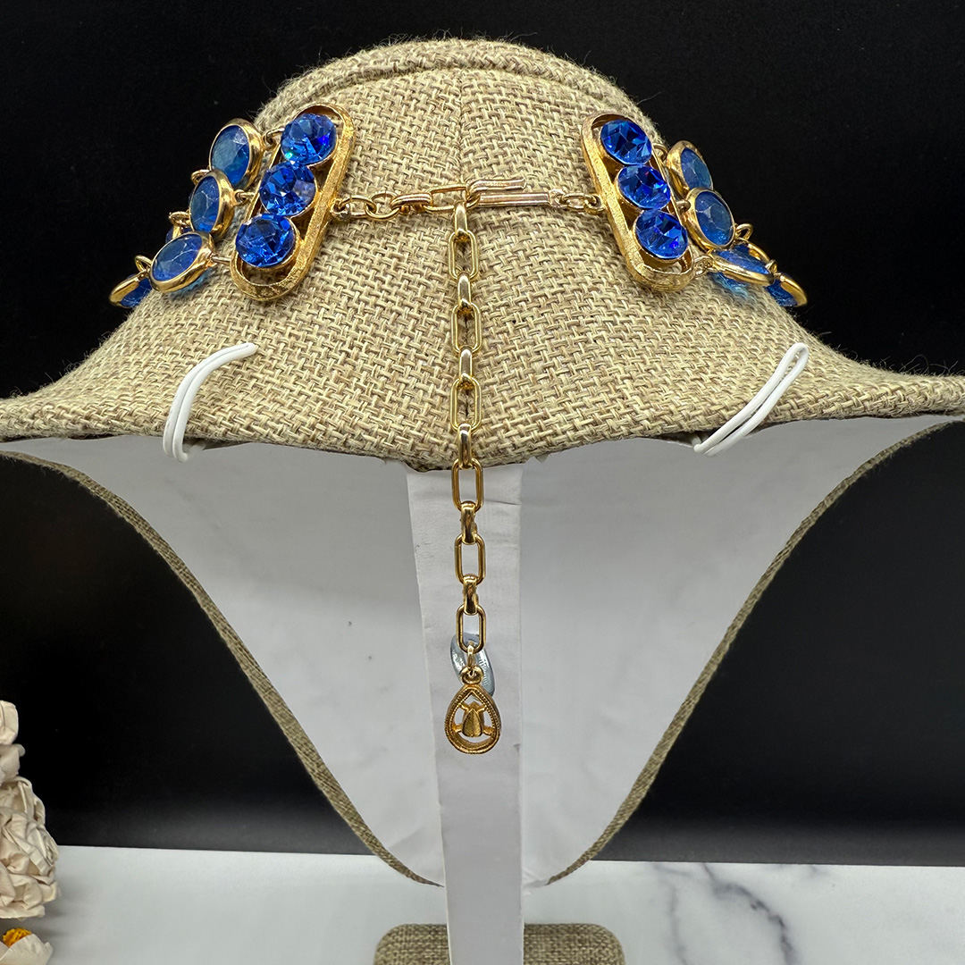 Triple-layer Coro-style bezel-set necklace.