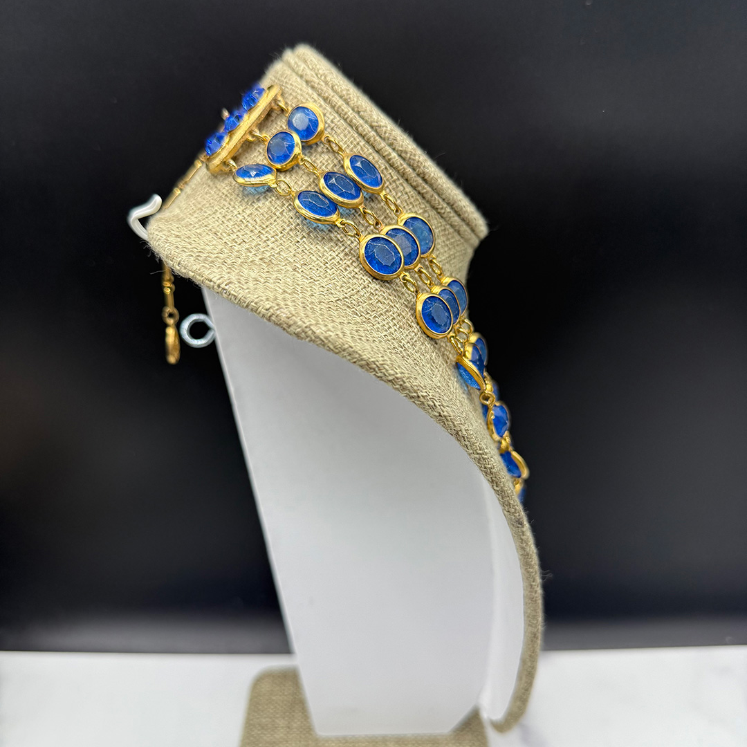 Triple-layer Coro-style bezel-set necklace.