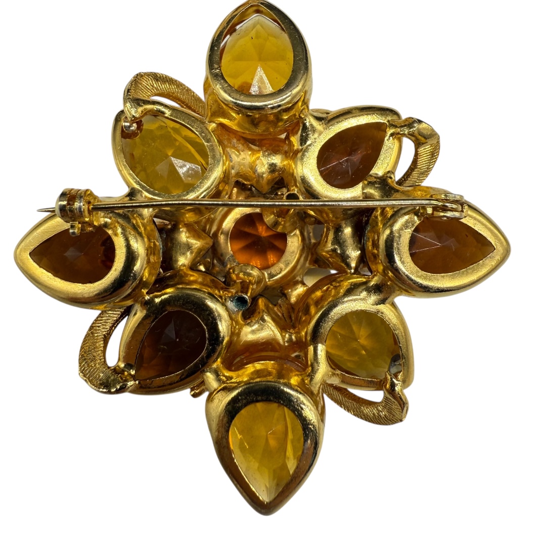 Wonderful amber-colored rhinestone brooch.