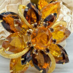 Wonderful amber-colored rhinestone brooch.