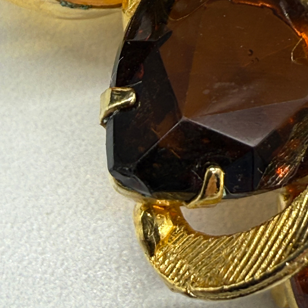 Wonderful amber-colored rhinestone brooch.