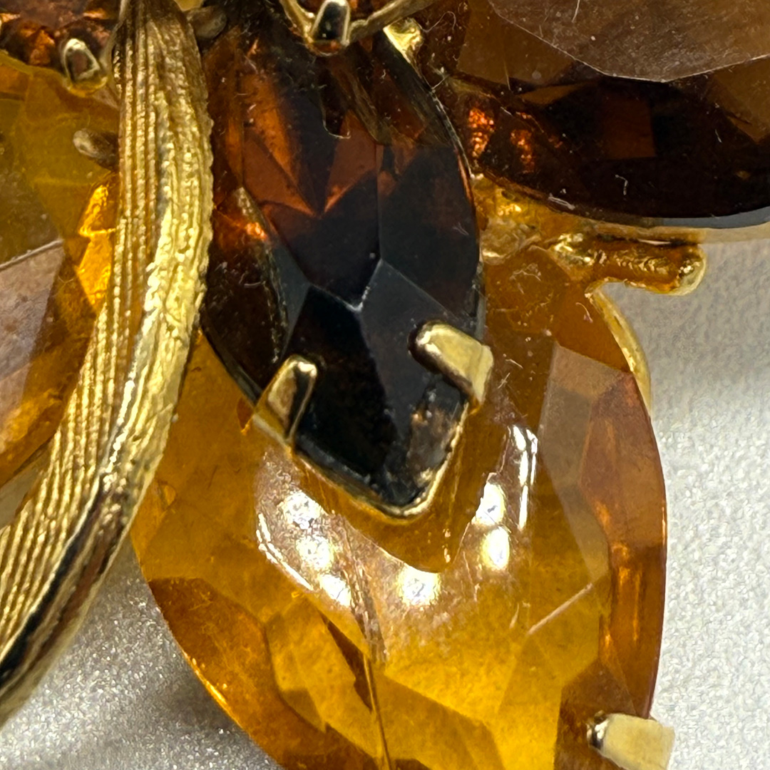 Wonderful amber-colored rhinestone brooch.