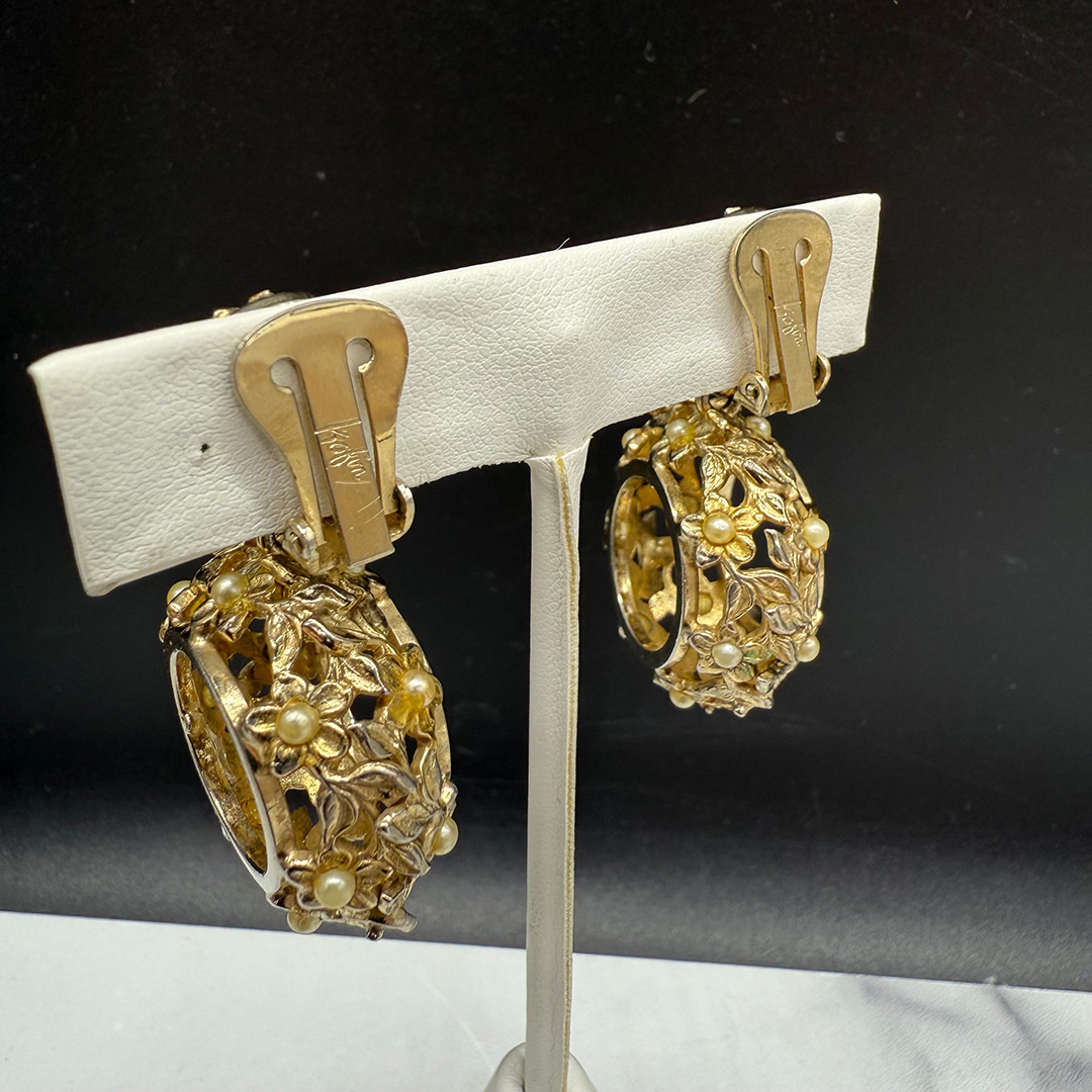 Kafin open metalwork floral drop earrings.