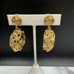 Kafin open metalwork floral drop earrings.