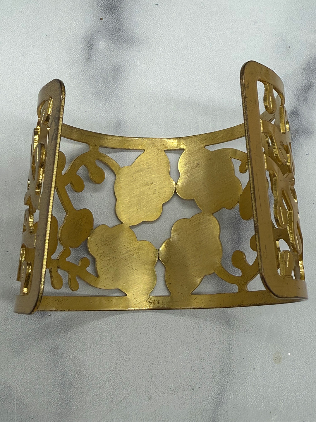 Vintage floral cuff with open-metalwork.