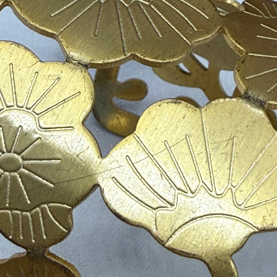 Vintage floral cuff with open-metalwork.