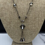 1930s Deco-style sautoir necklace up close.