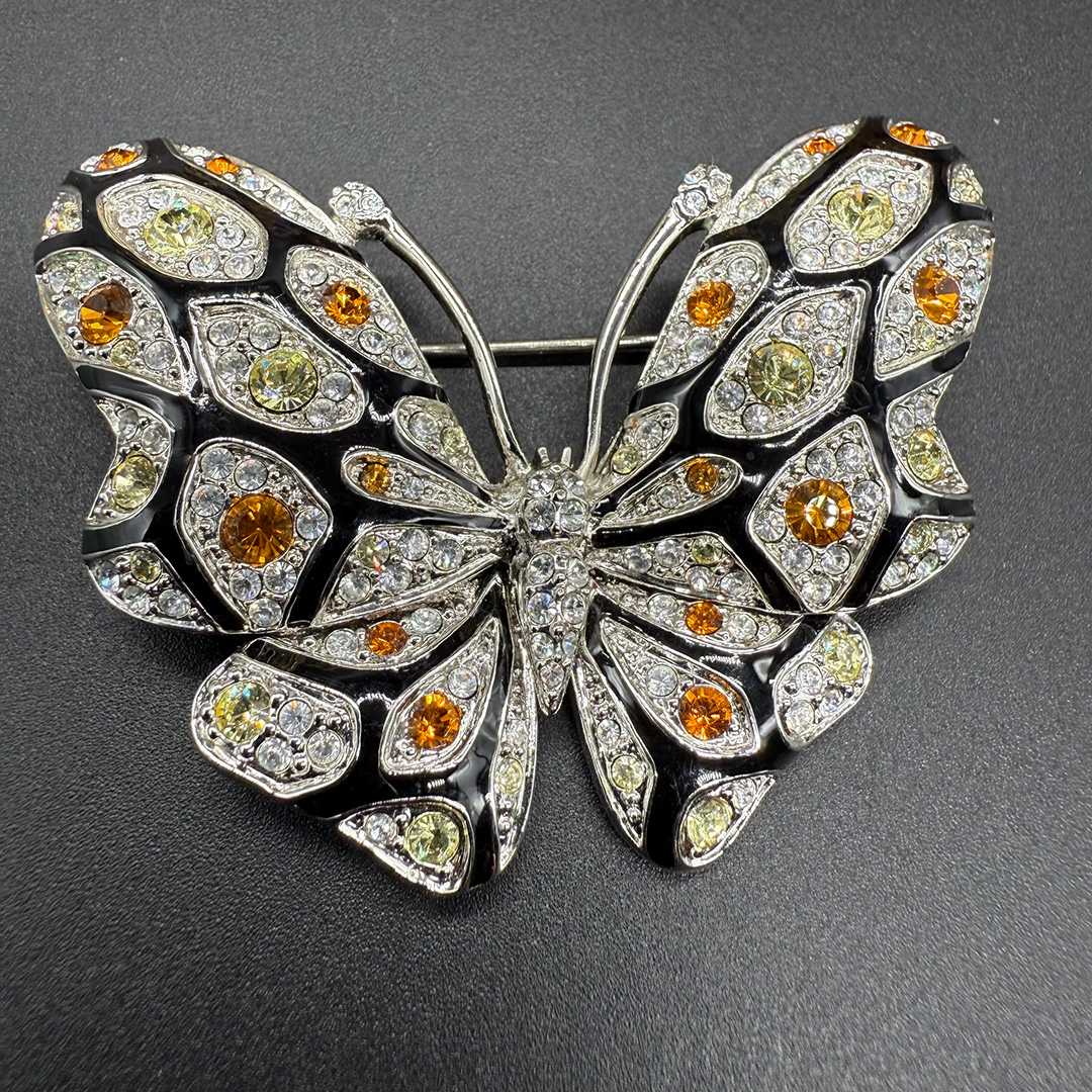 Nolan Miller butterfly brooch.